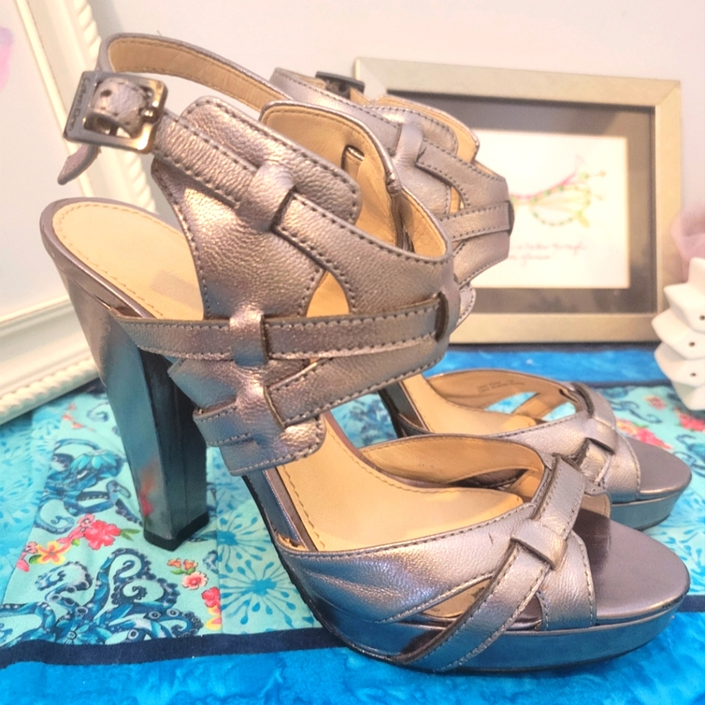 Calvin Klein gunmetal gray/silver heels. Size 7. Great used condition.